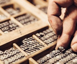 Artisan composing movable type for Letterpress Printing.